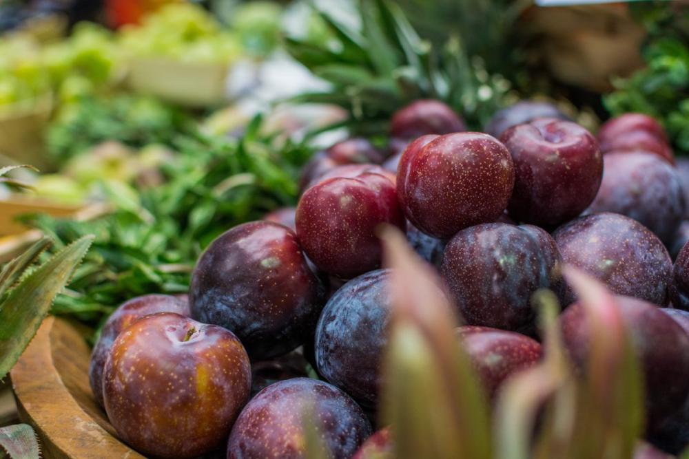 Fresh plums at a farmers market Fresh plums at a farmers market