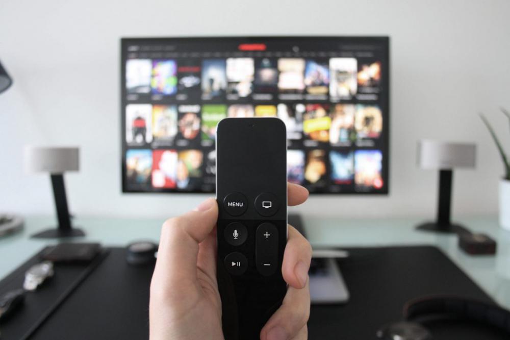 Man using Apple TV Man using Apple TV