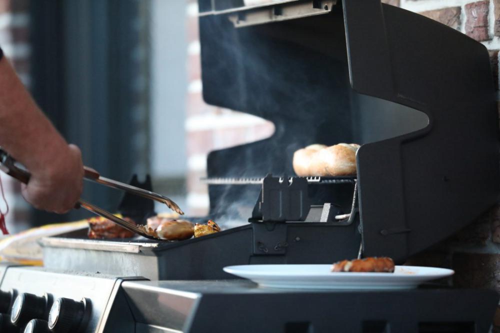 Man Cooking on BBQ Man Cooking on BBQ