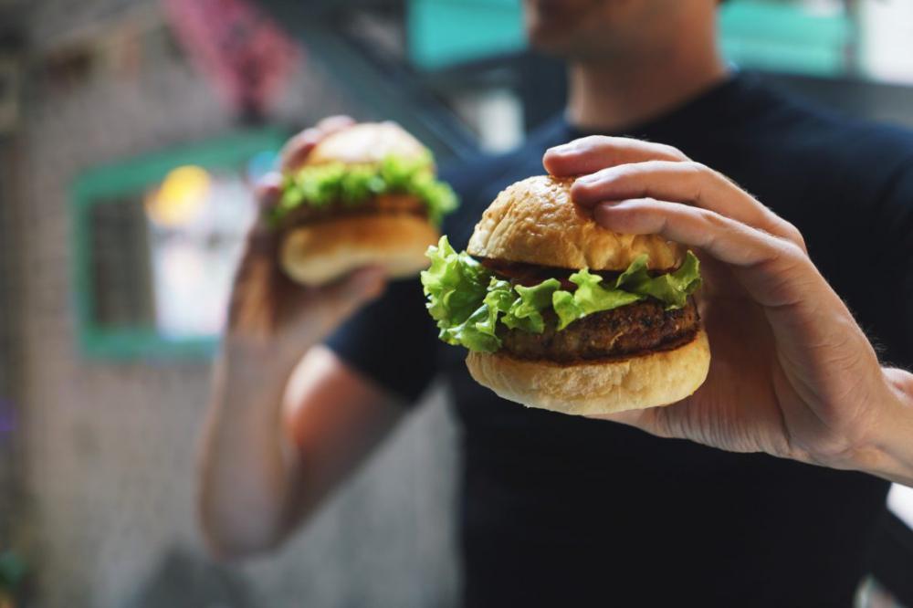 Man Holding Burgers Man Holding Burgers