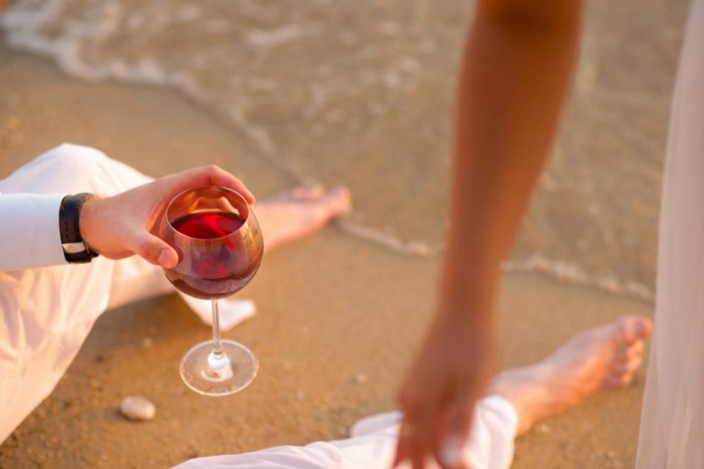 Couple Drinking Wine on Beach Couple Drinking Wine on Beach