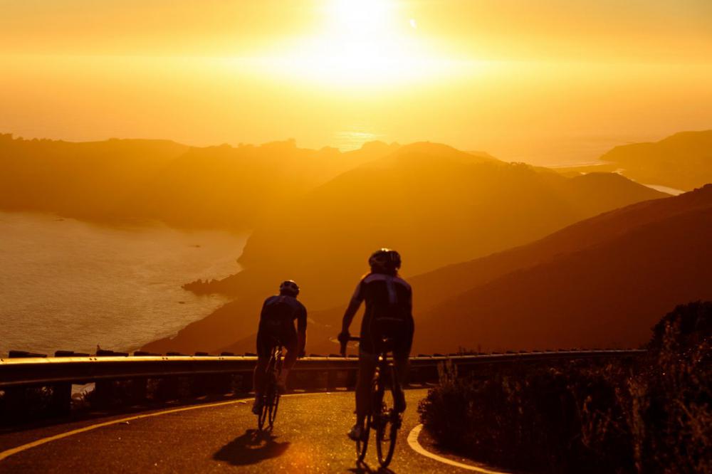 Men Cycling at Sunset Men Cycling at Sunset