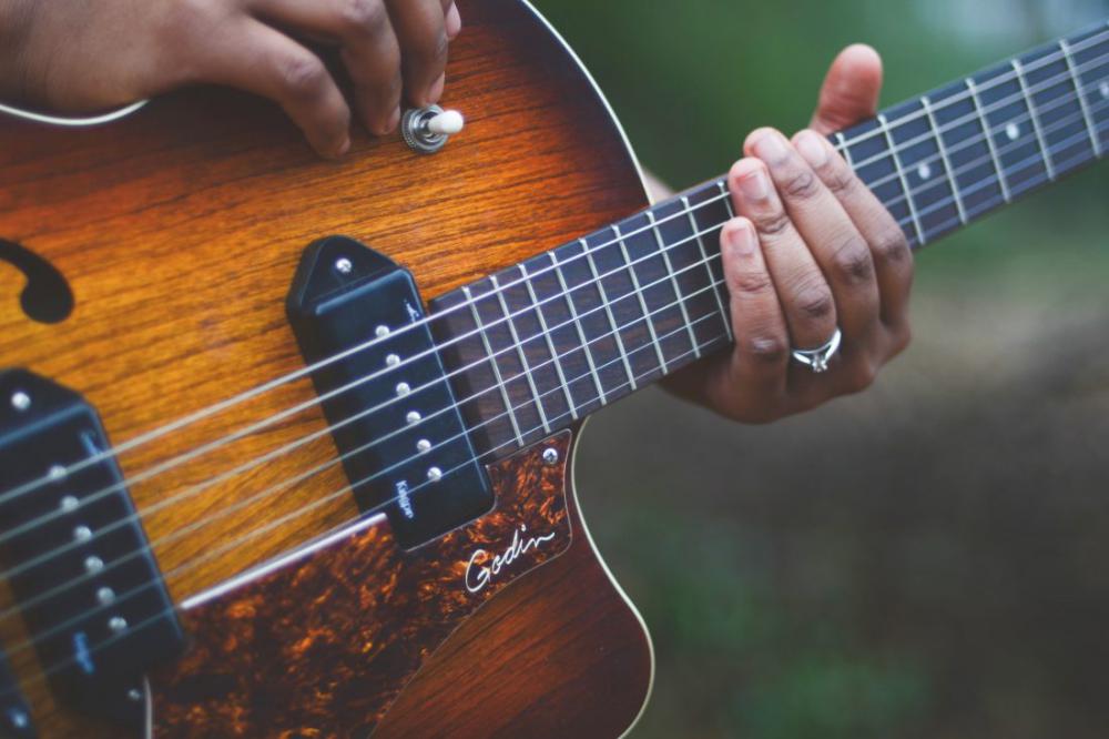 Person Playing Guitar Person Playing Guitar