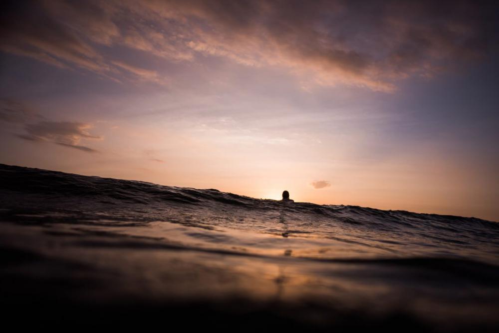 Surfer at Sunset Waiting for Waves Surfer at Sunset Waiting for Waves