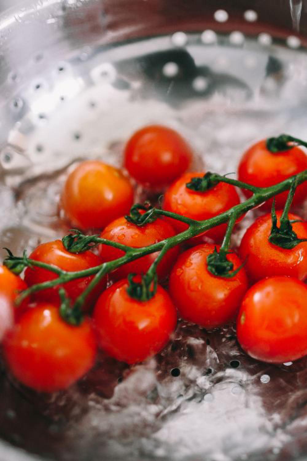 Washing vegetables in colander Washing vegetables in colander