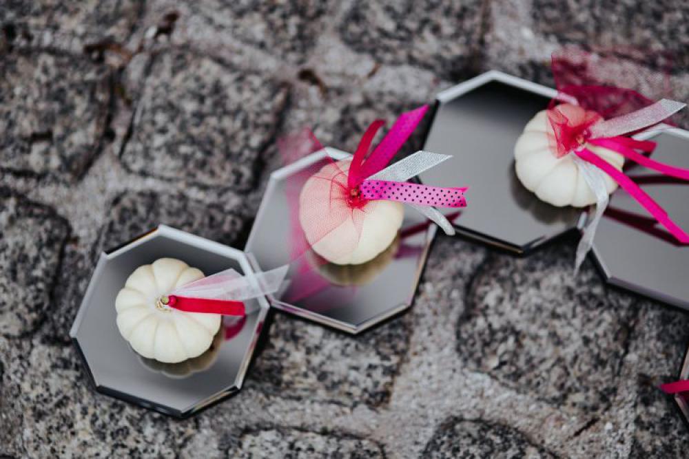 Decorative white pumpkin trinkets with ribbons on the floor Decorative white pumpkin trinkets with ribbons on the floor