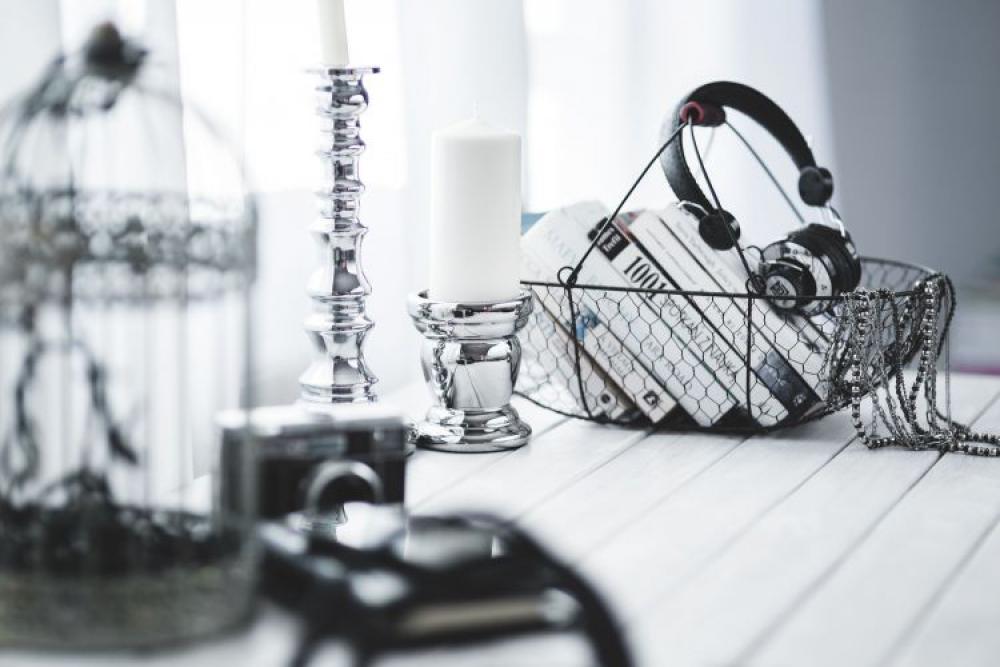 Black smartphone and headphones with various items Black smartphone and headphones with various items