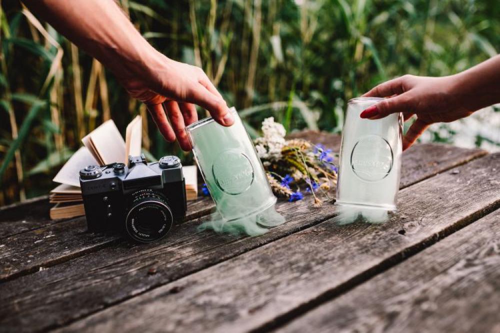 Colorful smoke bomb, book and vintage camera Colorful smoke bomb, book and vintage camera