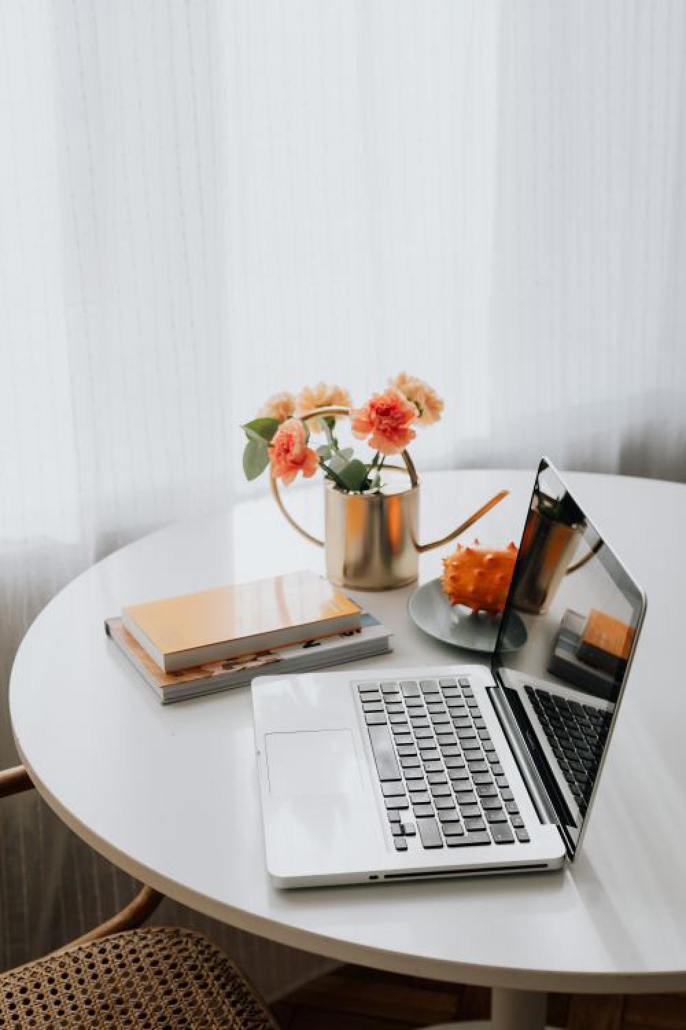 A woman works on a laptop at home A woman works on a laptop at home
