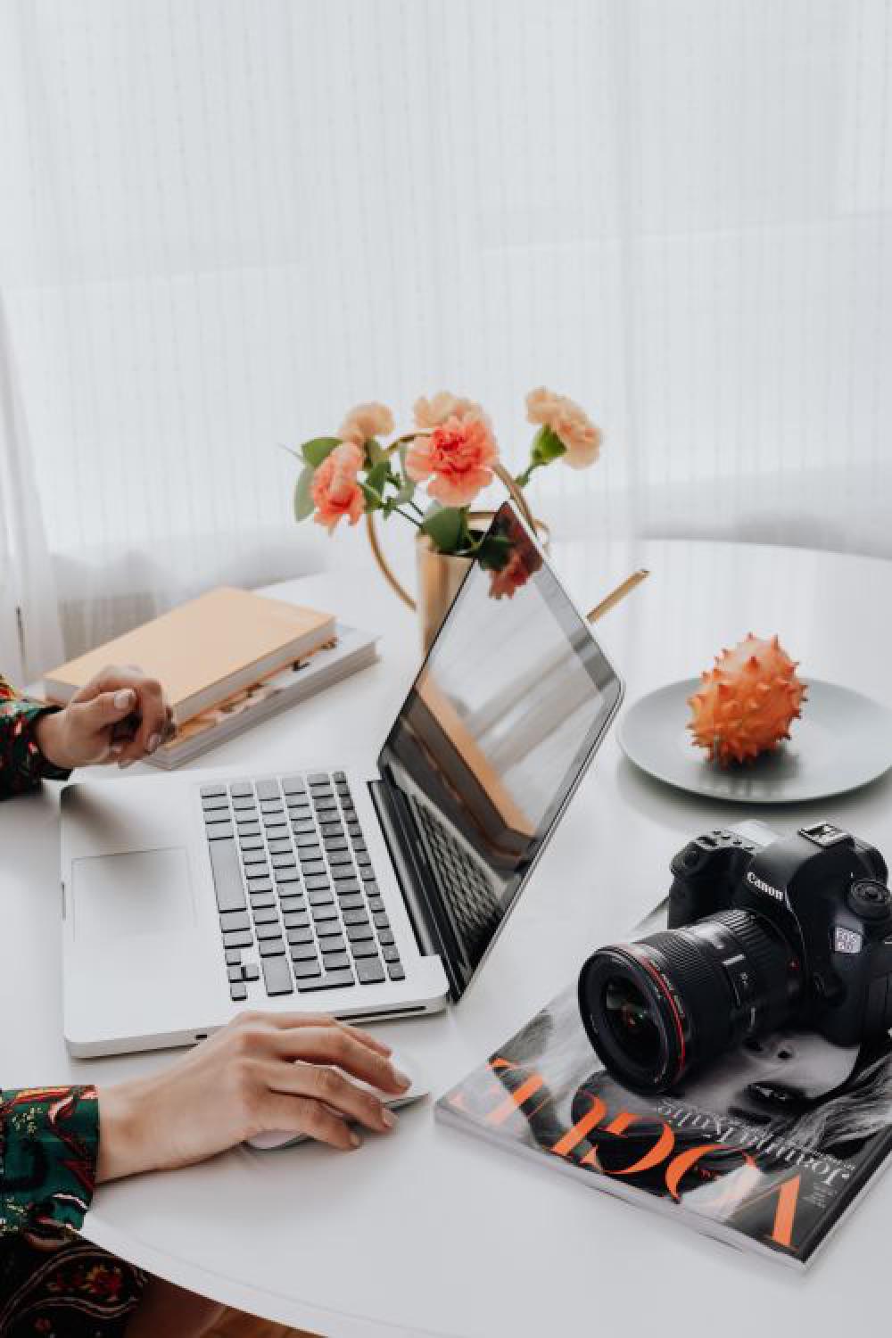 A woman works on a laptop at home A woman works on a laptop at home
