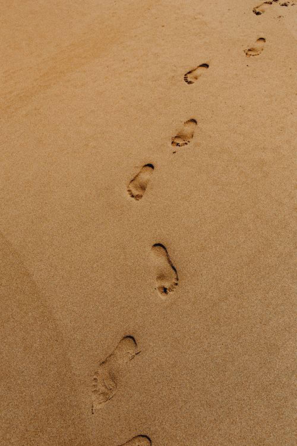 Footprints on a sandy beach, Portugal Footprints on a sandy beach, Portugal