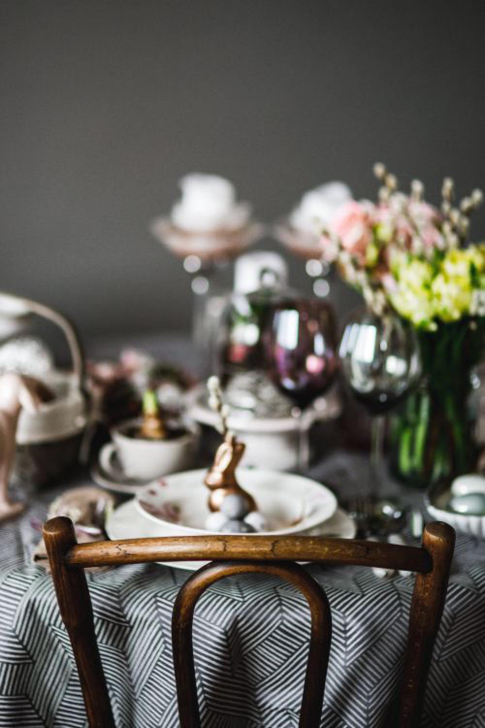 Round dinner table decorated with easter motifs Round dinner table decorated with easter motifs