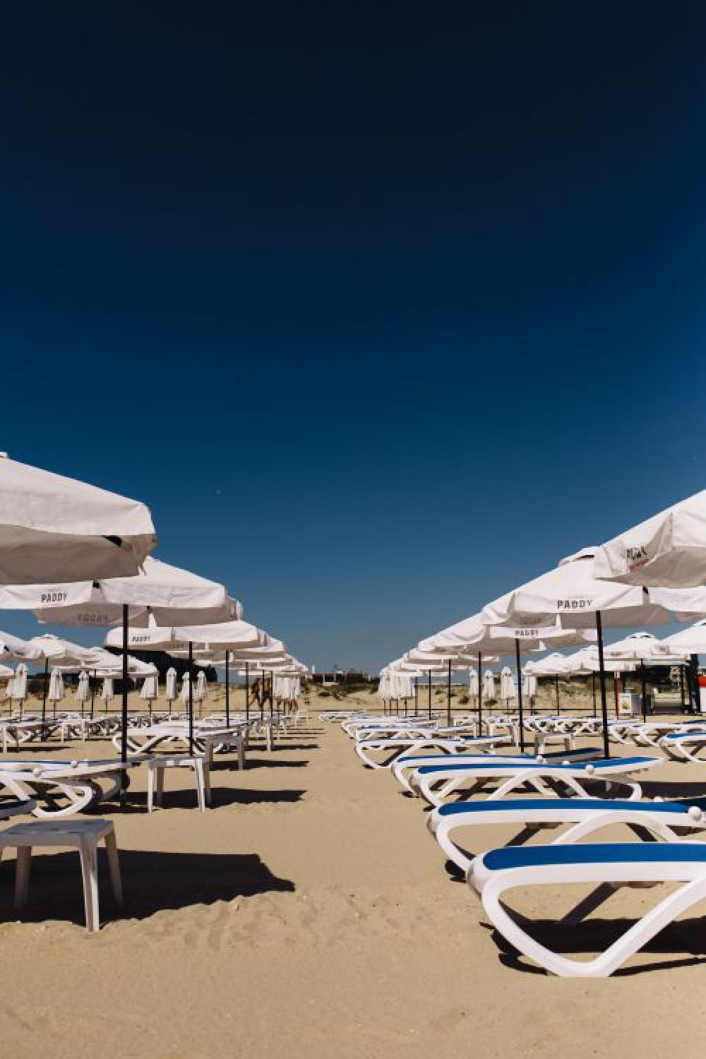 Umbrellas and lounge chairs on Sunny Beach, Bulgaria Umbrellas and lounge chairs on Sunny Beach, Bulgaria