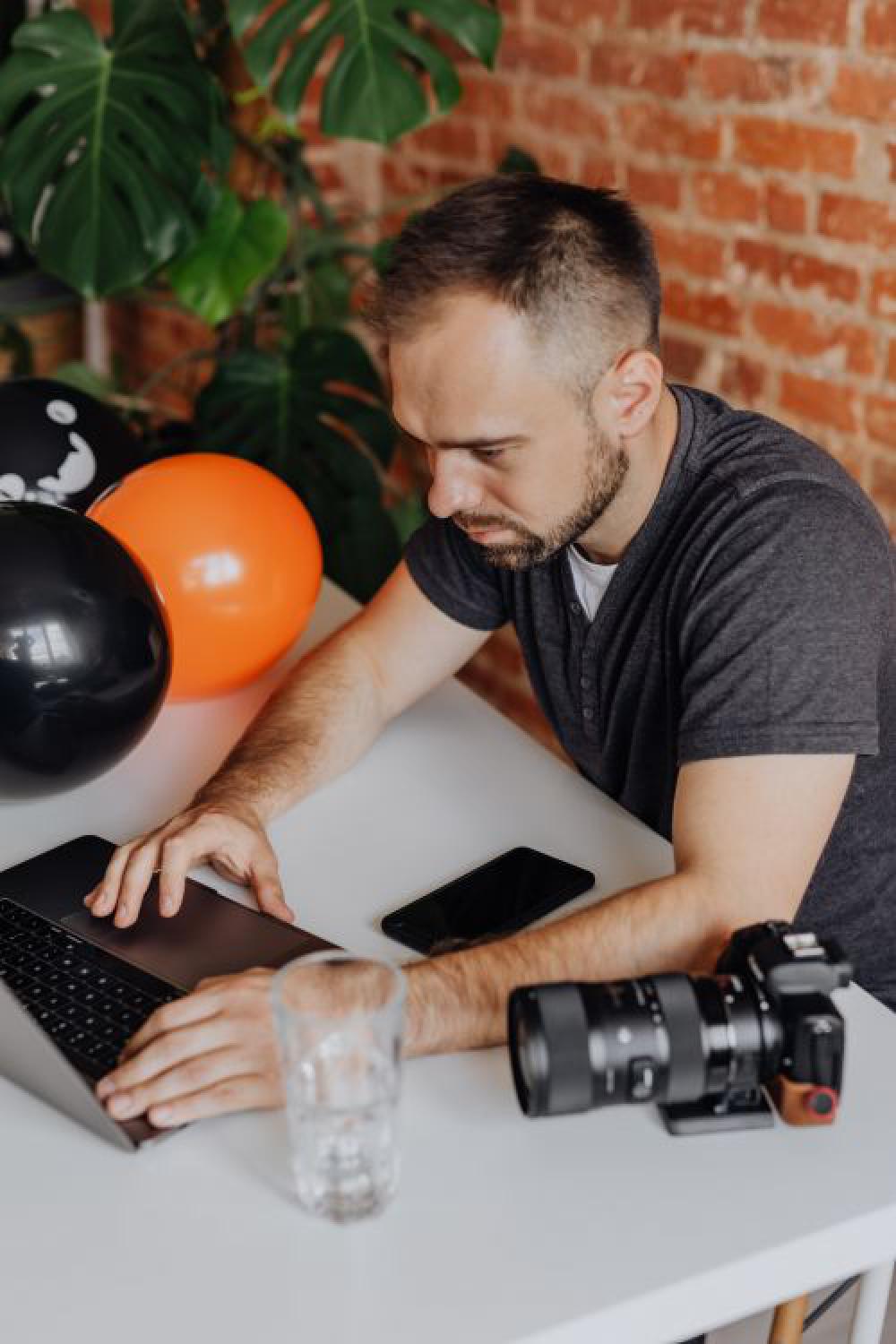 The photographer works at his desk during Halloween The photographer works at his desk during Halloween