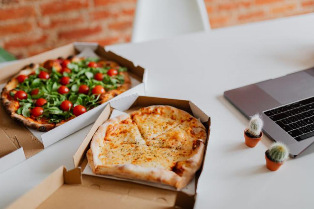 A workplace full of pizza A workplace full of pizza