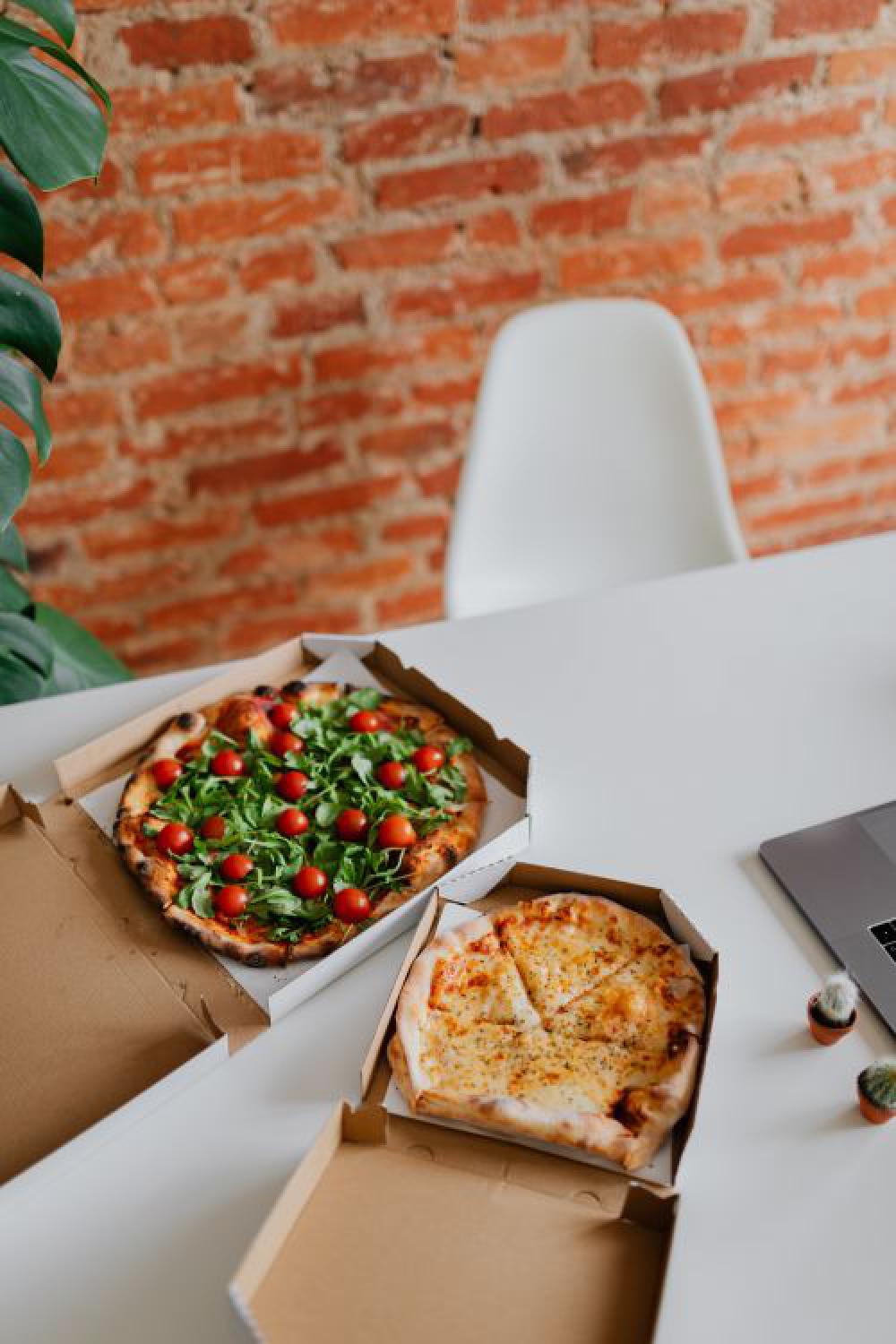 A workplace full of pizza A workplace full of pizza
