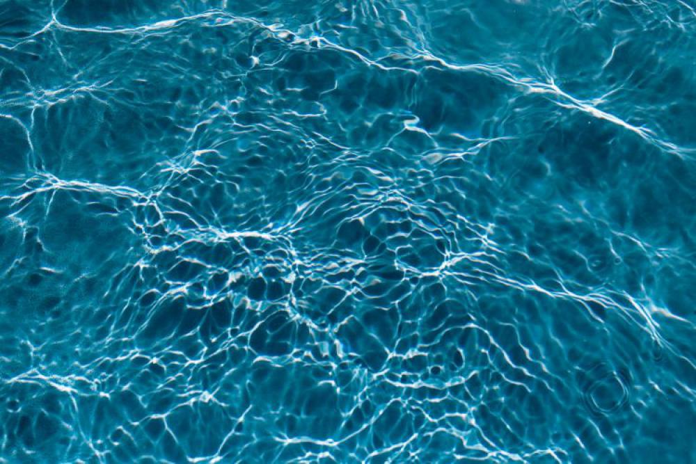 Wavy water surface in a swimming pool Wavy water surface in a swimming pool
