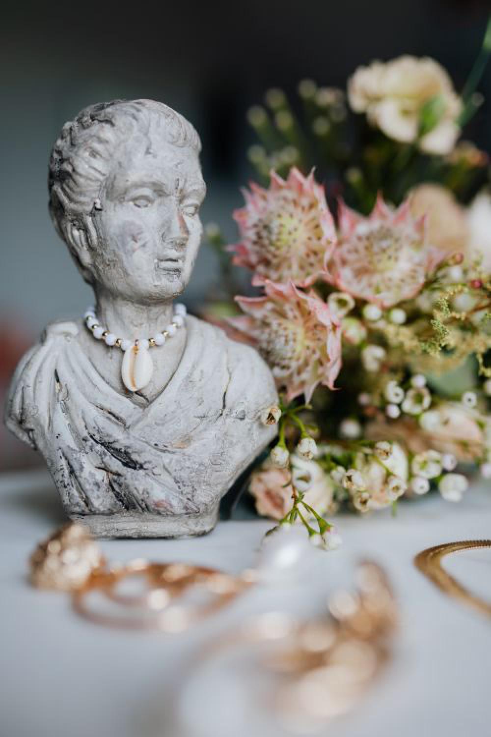 Gold jewelry on white marble Gold jewelry on white marble