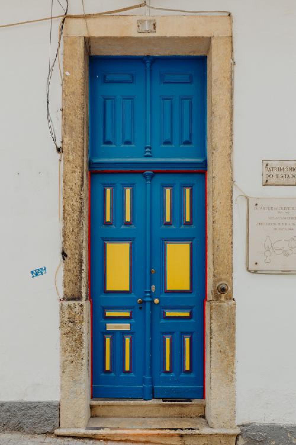 Colorful wooden door in the facade of a typical Portuguese house at Lisbon, Portugal Colorful wooden door in the facade of a typical Portuguese house at Lisbon, Portugal