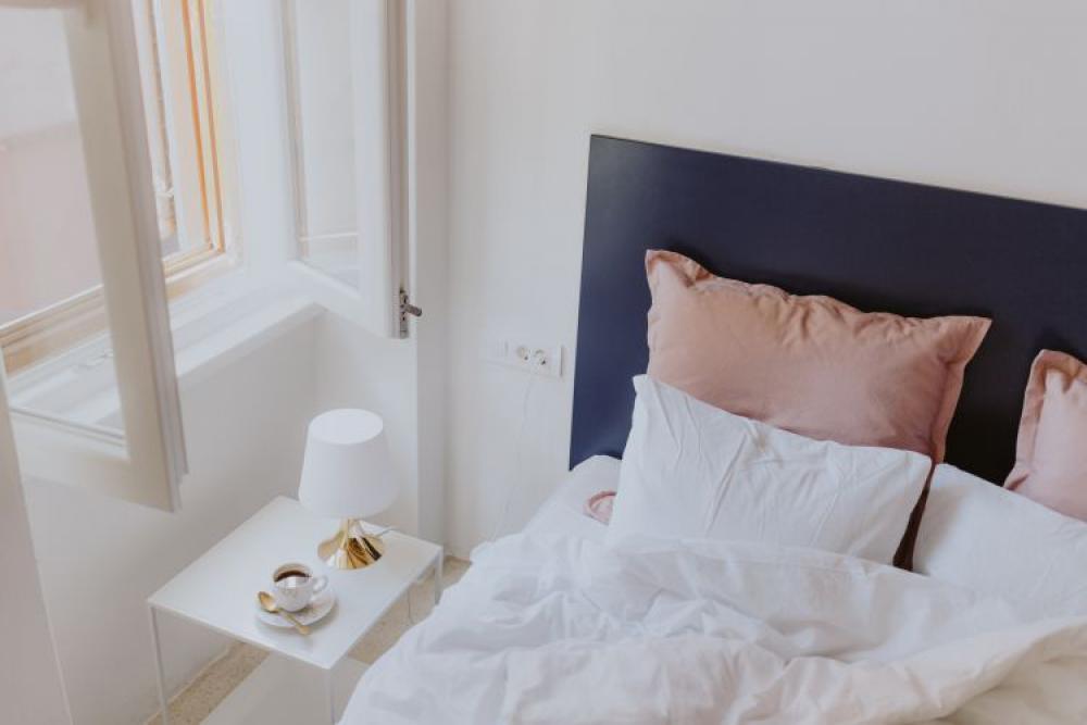 White bedroom interior with window White bedroom interior with window