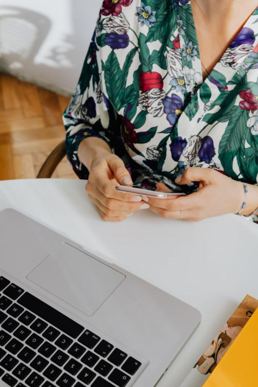 A woman works on a laptop at home A woman works on a laptop at home