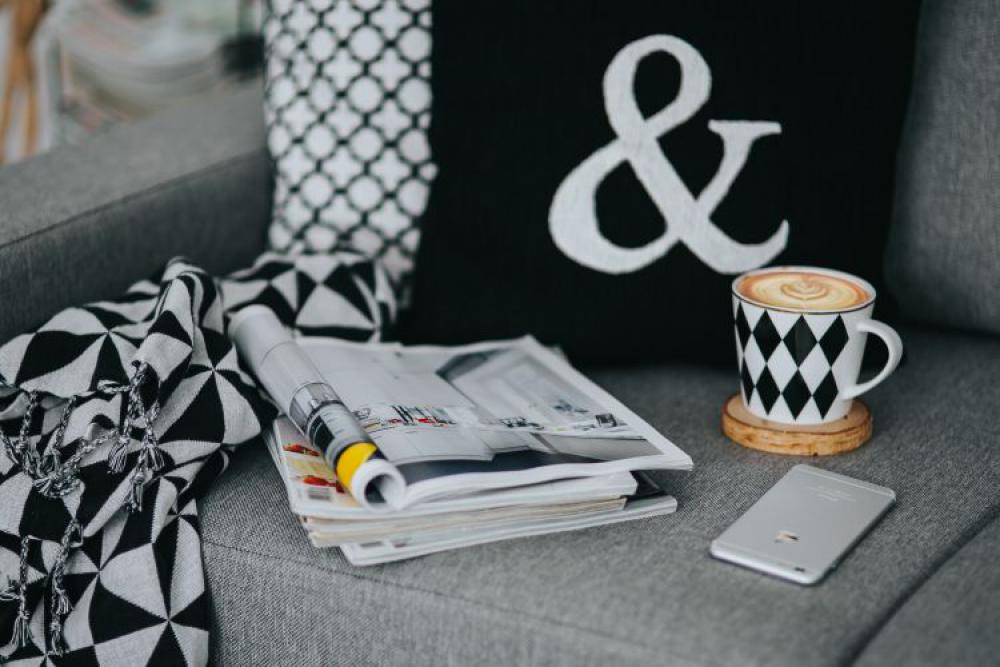 Resting with magazines and cup of coffee Resting with magazines and cup of coffee