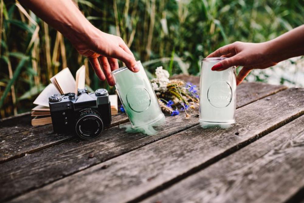 Colorful smoke bomb, book and vintage camera Colorful smoke bomb, book and vintage camera