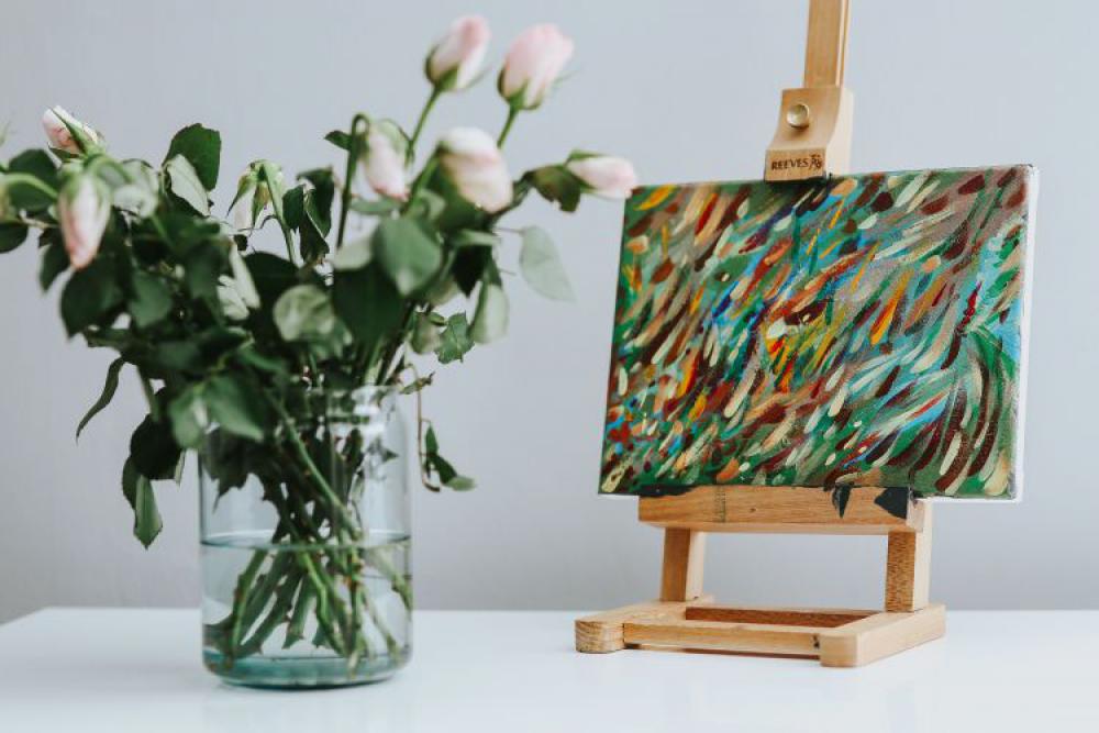 Black cat with flowers and a painting Black cat with flowers and a painting