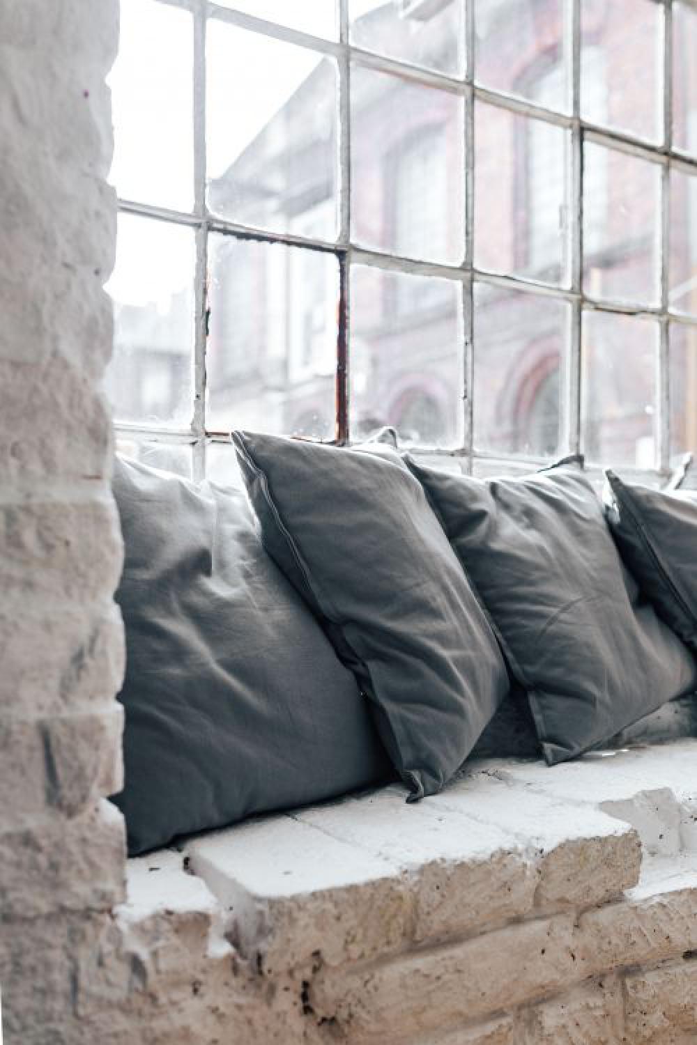 Collection of grey and white pillows Collection of grey and white pillows
