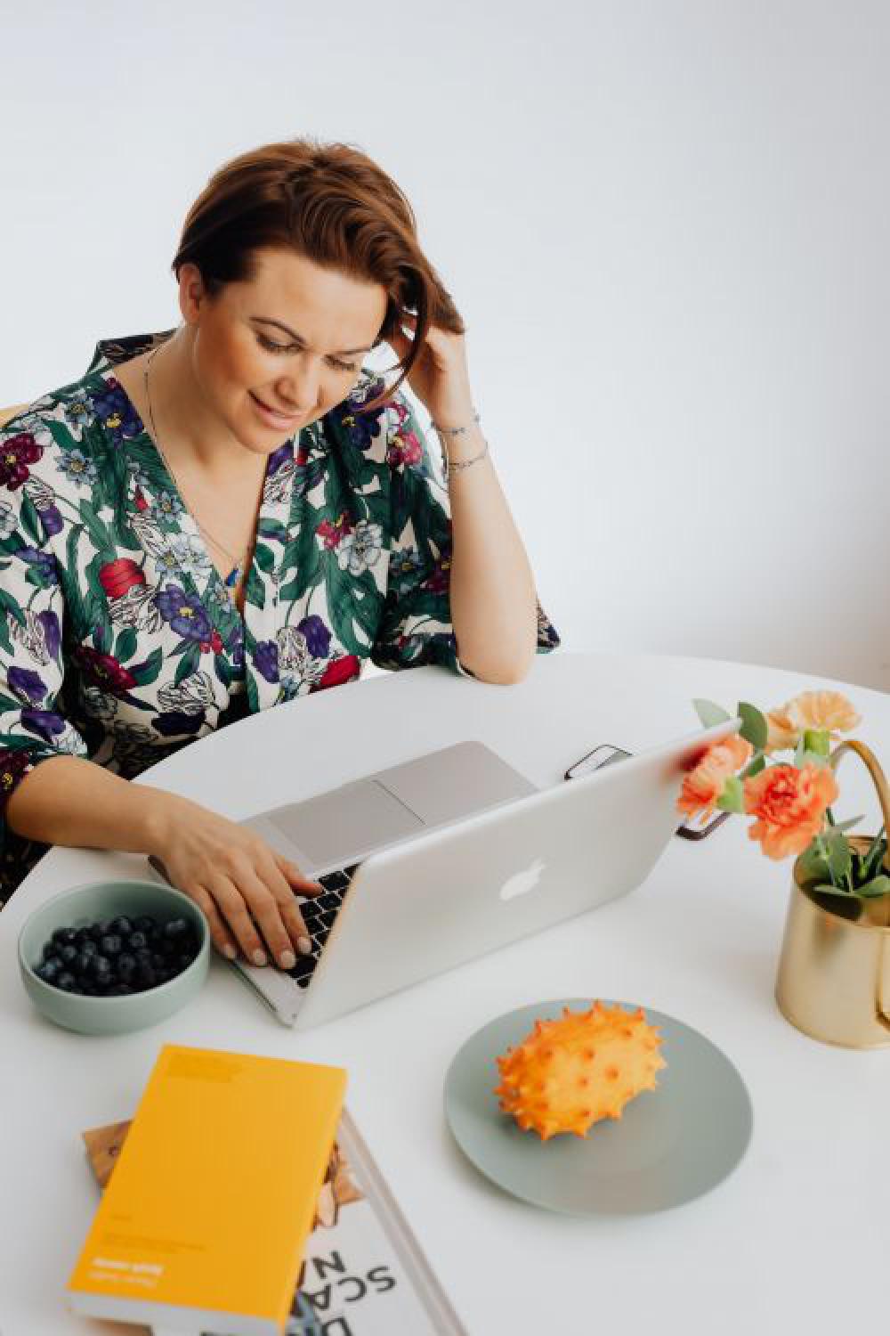 A woman works on a laptop at home A woman works on a laptop at home