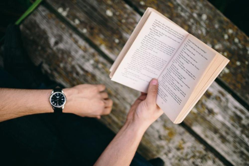 Reading book at lake Reading book at lake