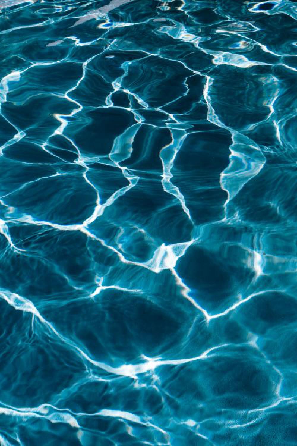Wavy water surface in a swimming pool Wavy water surface in a swimming pool