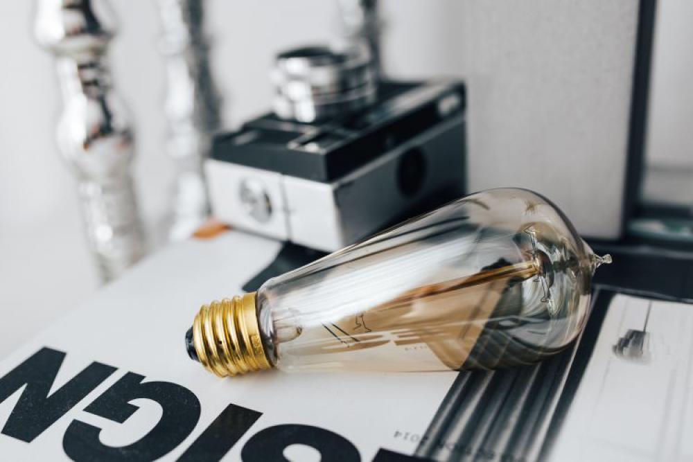 Pencils, magazines and an old lightbulb Pencils, magazines and an old lightbulb