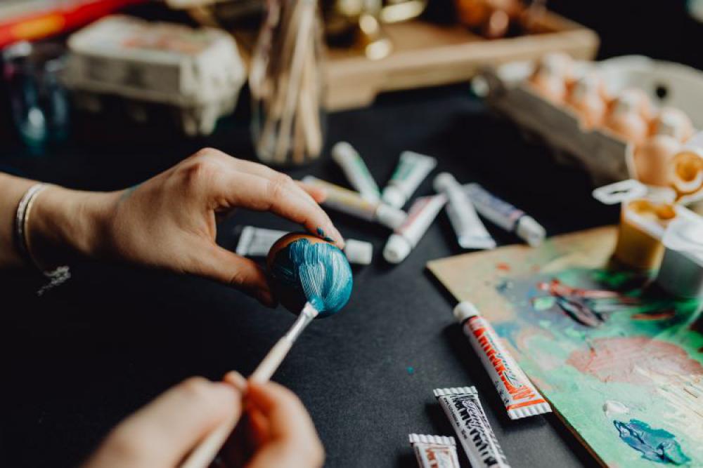 Woman Painting Easter Eggs Woman Painting Easter Eggs