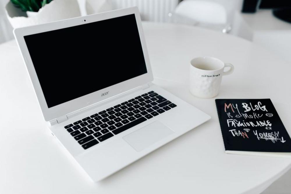 Workplace with laptop on table at home Workplace with laptop on table at home