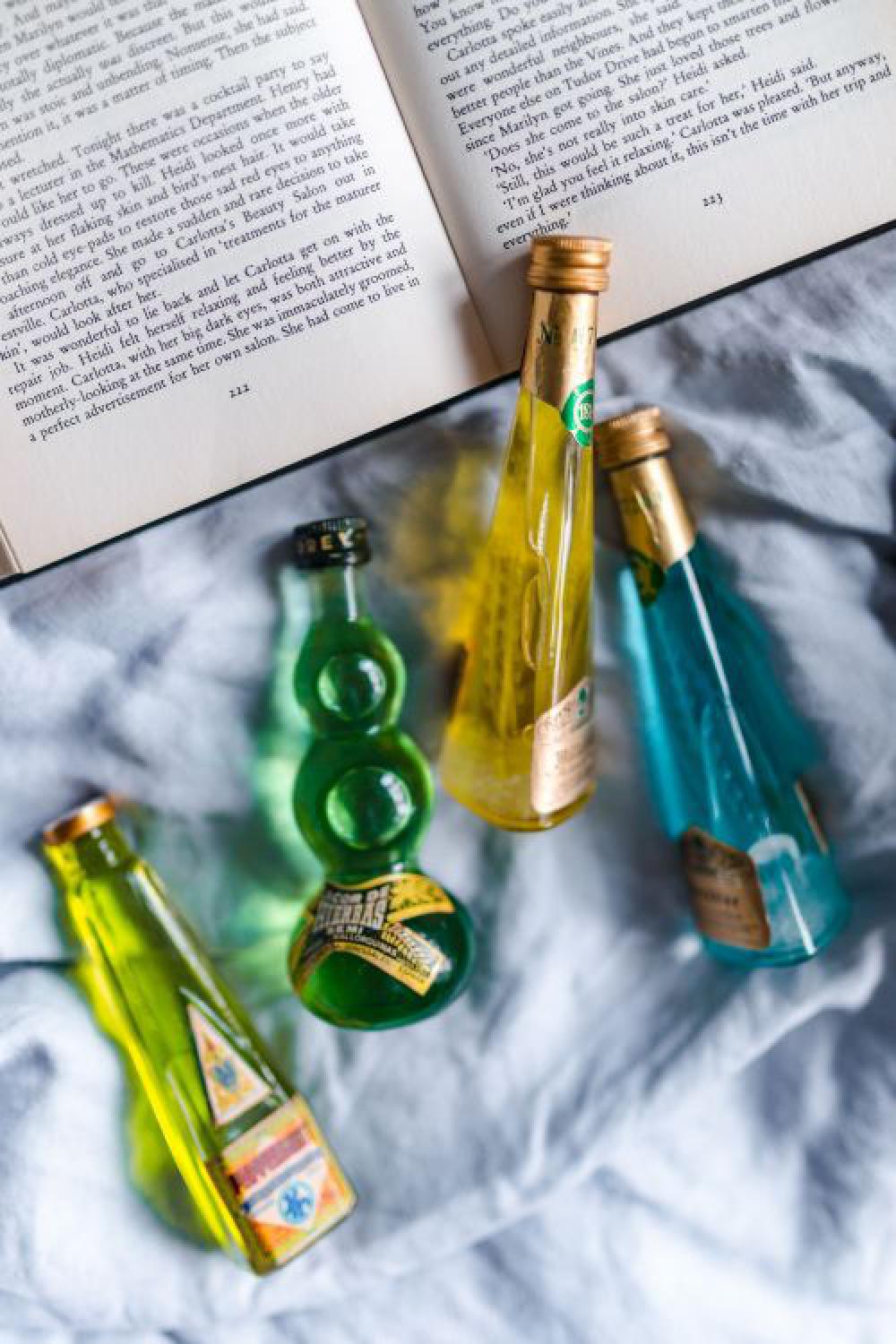 Group of colorful little bottles with liqueurs Group of colorful little bottles with liqueurs