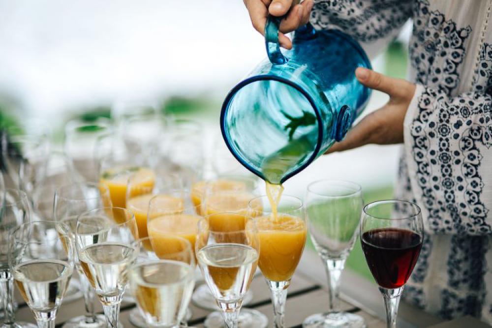 Glasses of orange juice, wine and water Glasses of orange juice, wine and water