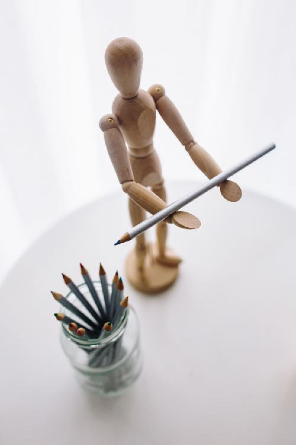 Wooden mannequin in various poses Wooden mannequin in various poses