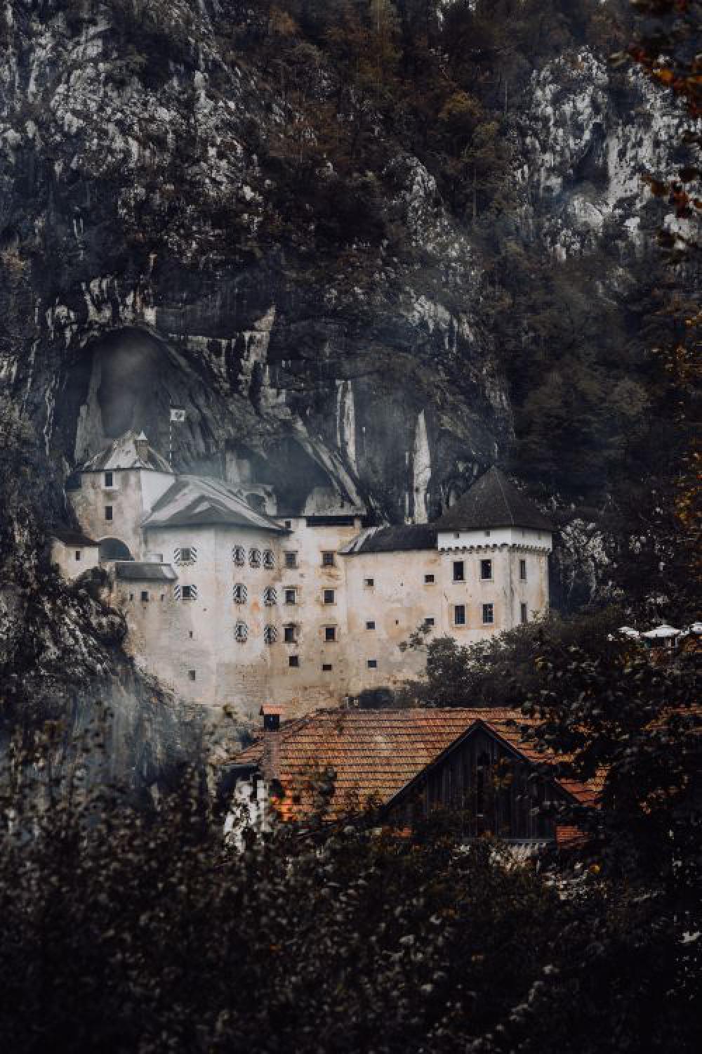 Predjama castle at the cave mouth in Postojna, Slovenia Predjama castle at the cave mouth in Postojna, Slovenia