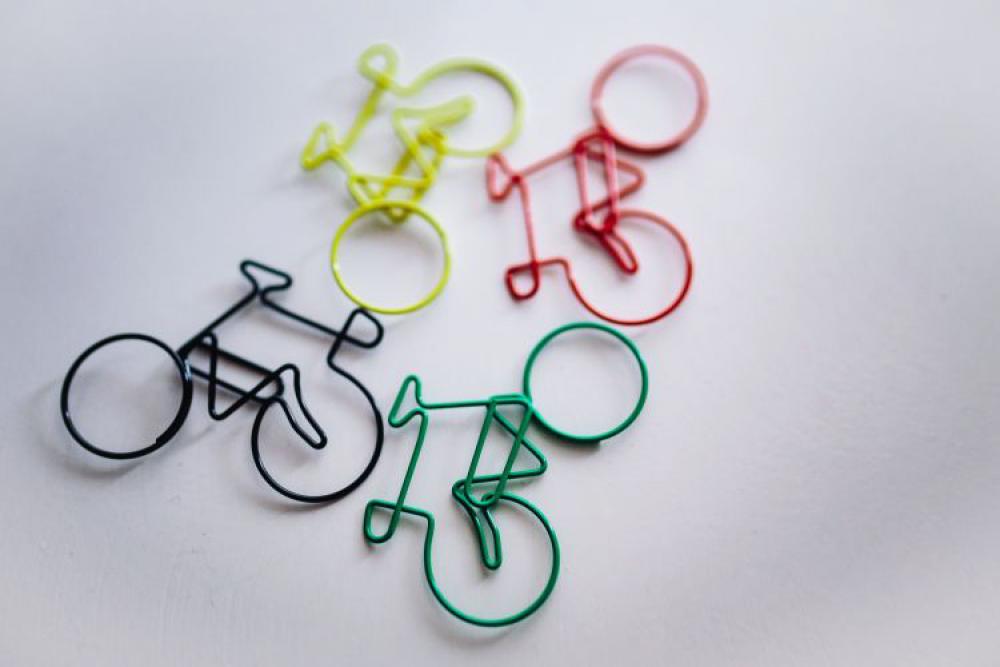 Bicycle paper clips and a wooden ruler Bicycle paper clips and a wooden ruler