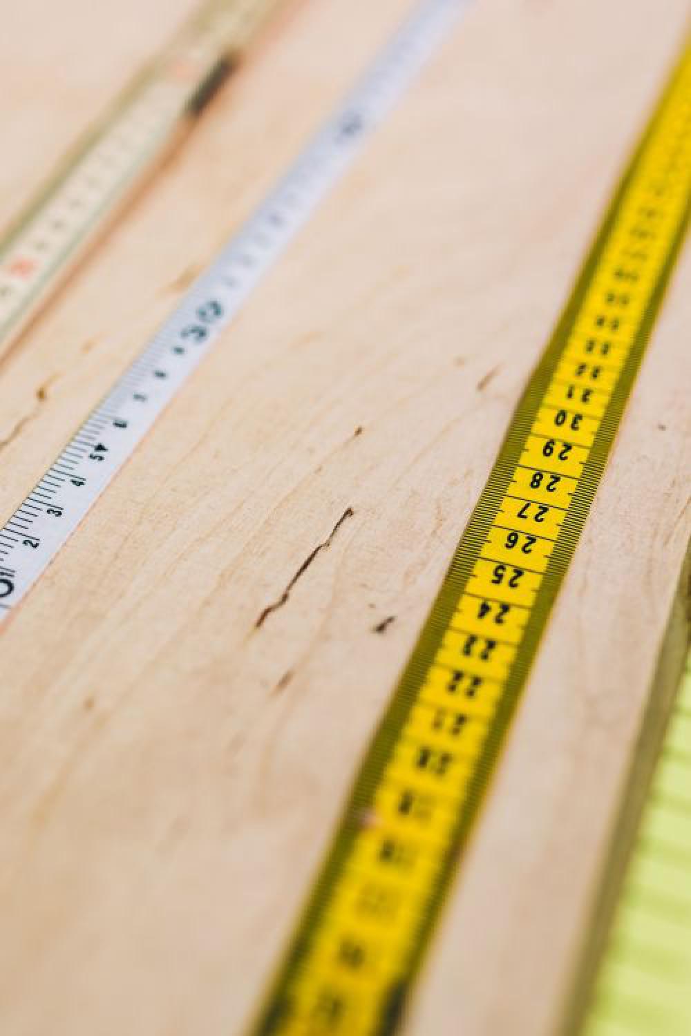 Close-ups of rulers on a wooden table Close-ups of rulers on a wooden table
