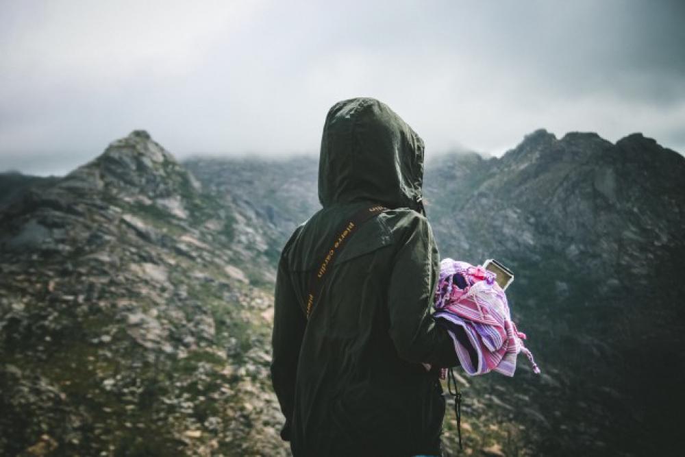 Millenial woman hiking in an inspirational moment. Adventure traveling. Millenial woman hiking in an inspirational moment. Adventure traveling.