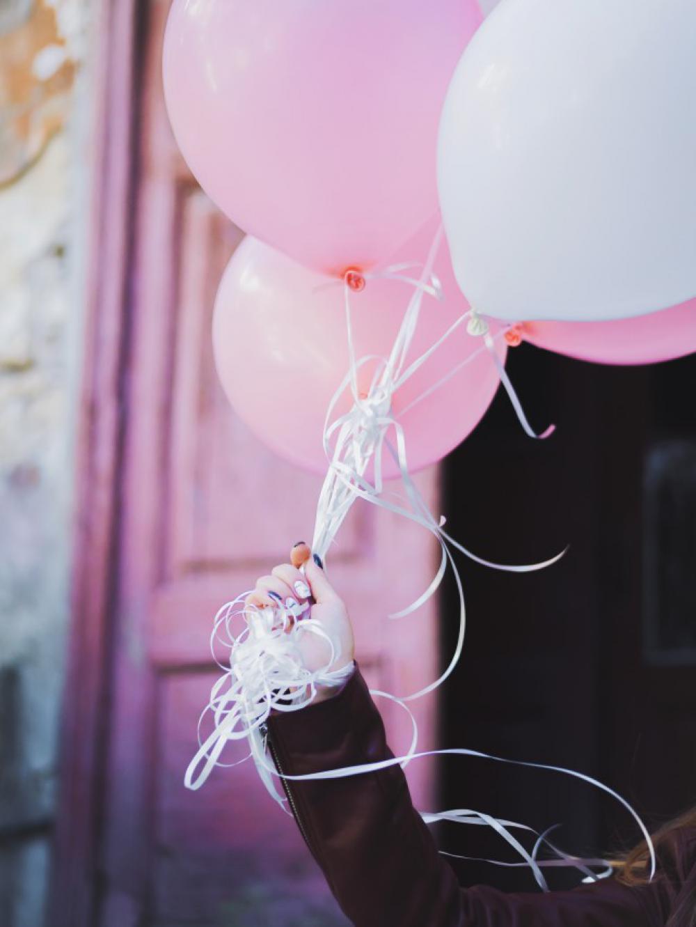 Birthday girl with pink balloons Birthday girl with pink balloons