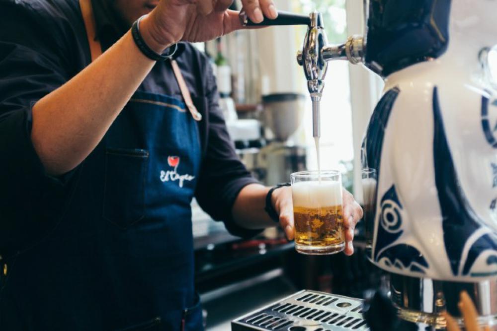 Pouring beer from the tap Pouring beer from the tap