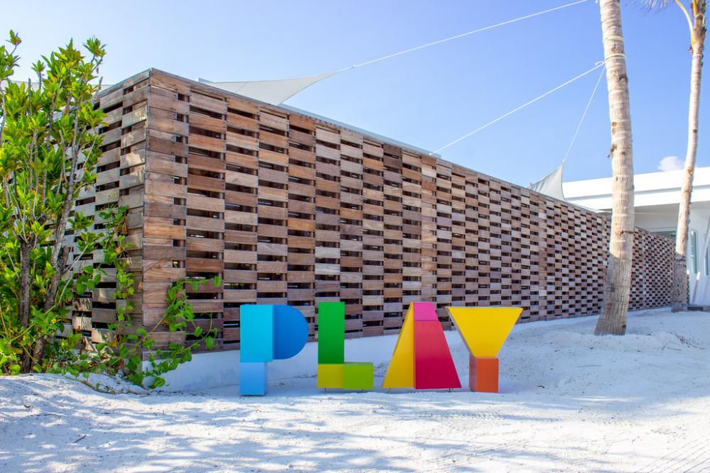 Colorful PLAY Sign On Sunny Beach With Fine Sand Colorful PLAY Sign On Sunny Beach With Fine Sand