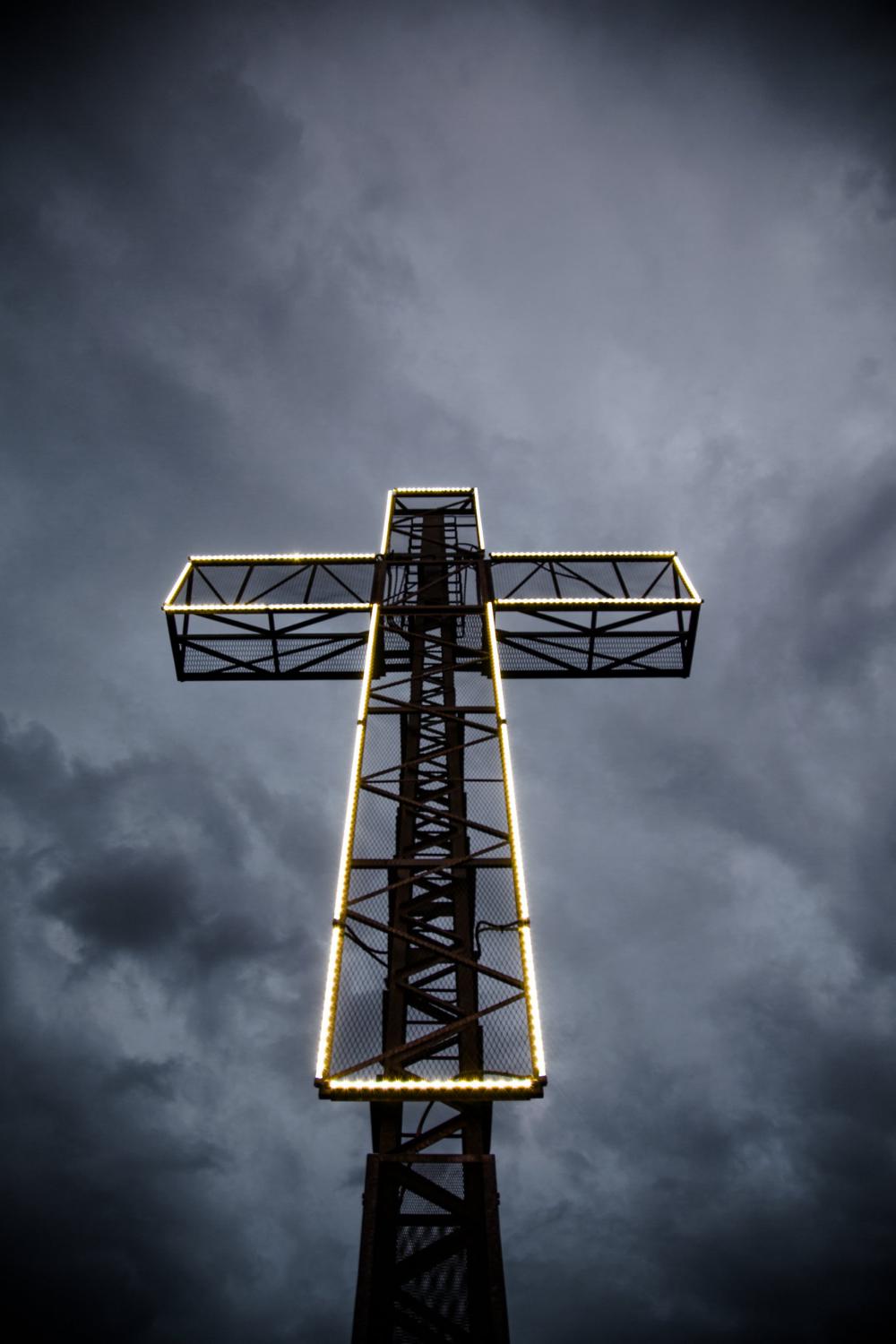 LED Lit Cross Against Stormy Sky Photo LED Lit Cross Against Stormy Sky Photo