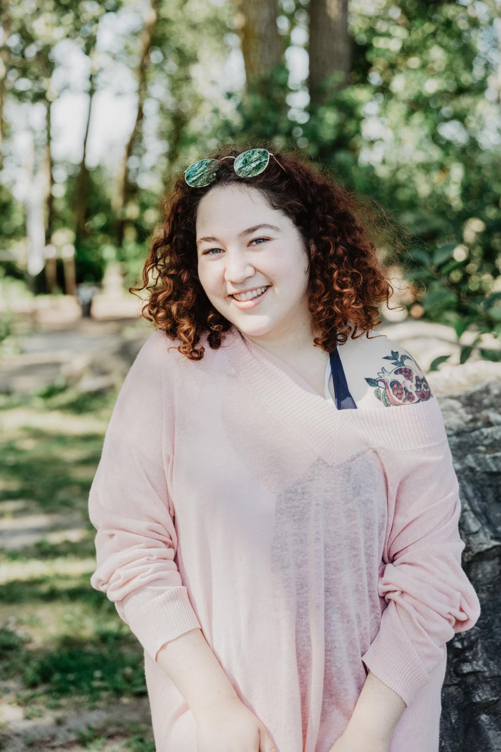 Young Woman With Curly Hair Smiling Bright Photo Young Woman With Curly Hair Smiling Bright Photo