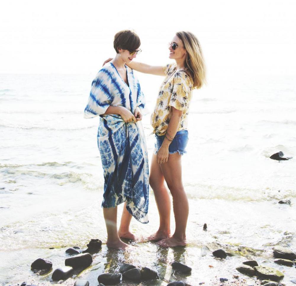 Two Caucasian women standing at a beach Two Caucasian women standing at a beach