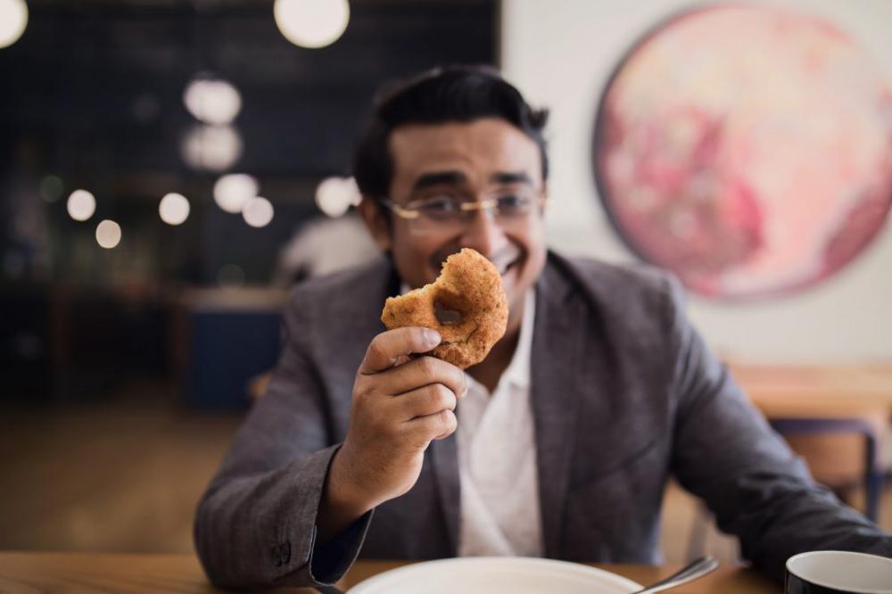 Businessman holding donut Businessman holding donut