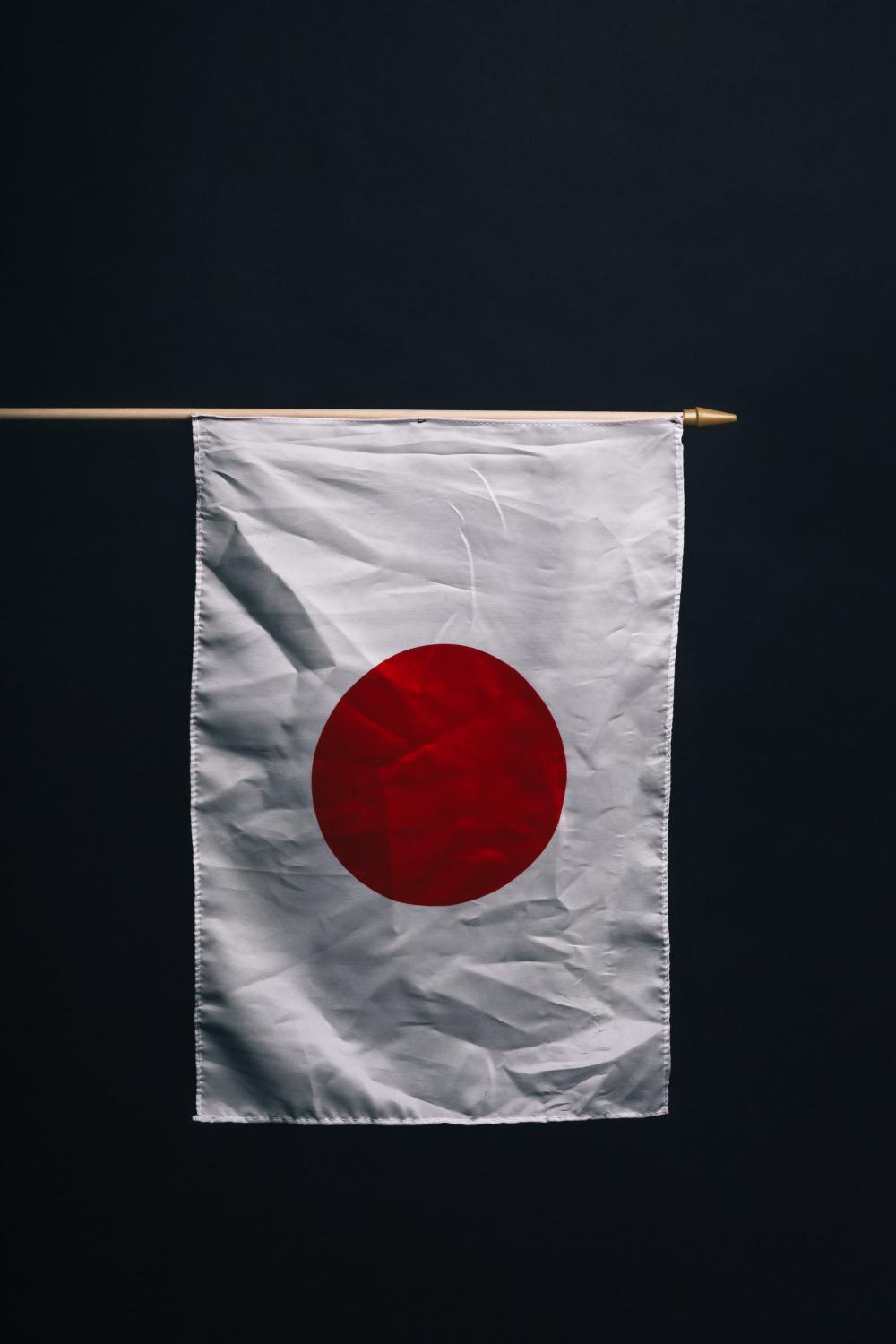 Japanese Flag Against Black Photo Japanese Flag Against Black Photo